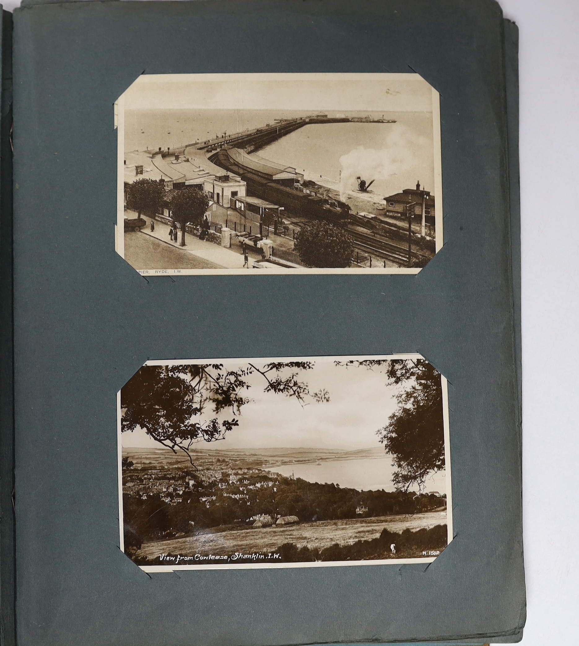A postcard album and various early 20th century postcards, of various views of UK towns, etc.